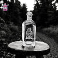 Clear glass decanter engraved with the Crafted Creations logo