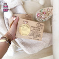 Personalised wooden Christmas nice list award with festive decorations