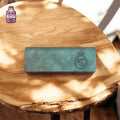 Engraved glasses case on a round wooden table