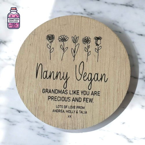 Round wooden Grandma disc engraved with flowers and the name Nanny Vegan