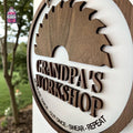 Round wooden Grandpa's workshop sign with tool silhouette