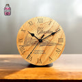 Round wooden clock engraved with Gibraltar scene and Roman numerals
