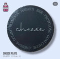 Round slate cheese board engraved with cheese names and script