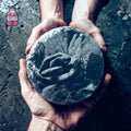Round slate coaster engraved with a detailed rose illustration