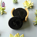 Round slate coasters with a wooden display holder