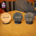Three round wooden reserved table discs in different finishes