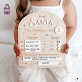 Wooden Dear Santa Christmas Eve treat board held in front of a child