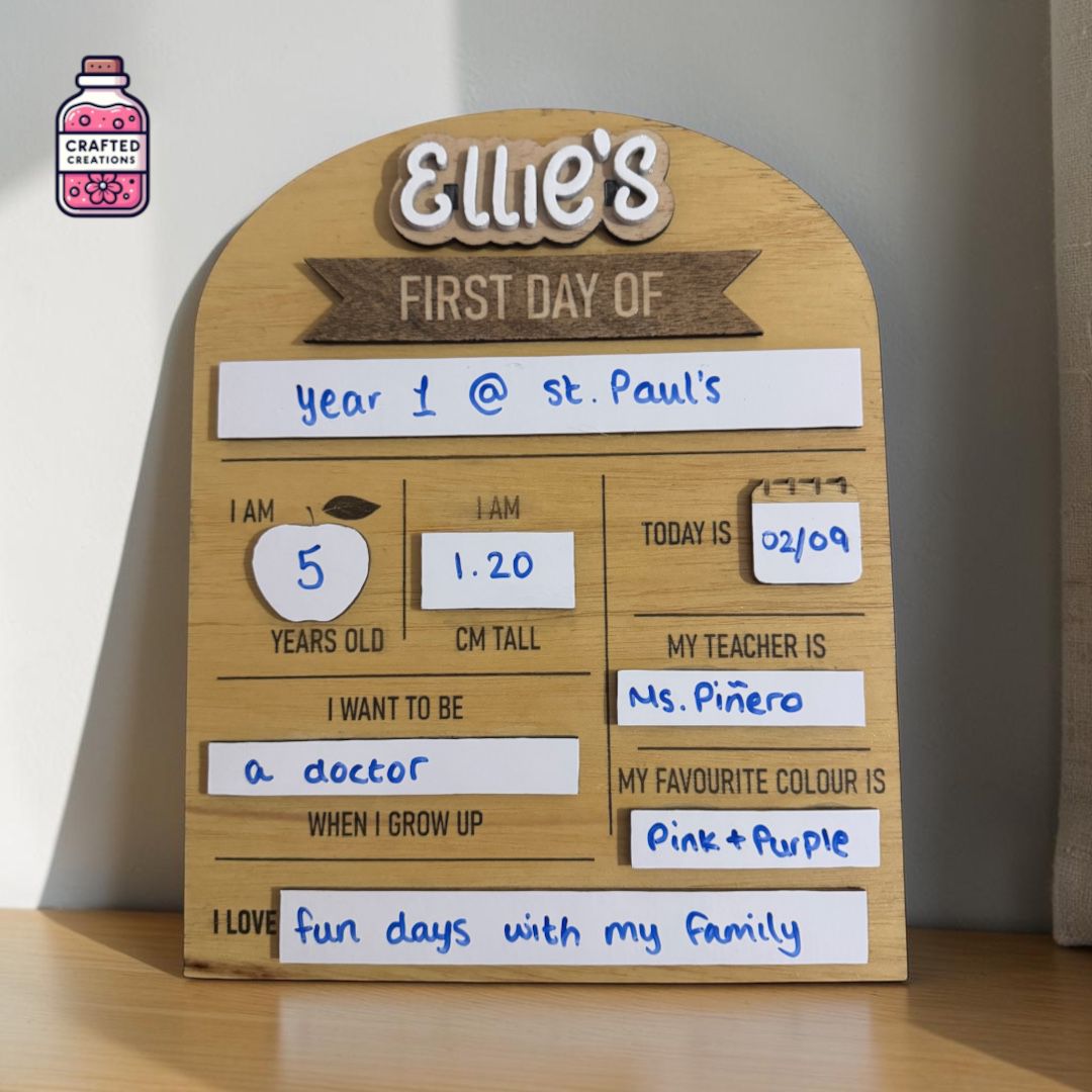 Wooden first day at school board filled in for Ellie