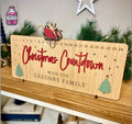 Wooden Christmas countdown board with engraved family name