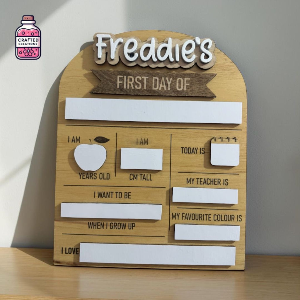 Wooden first day at school board with the name Freddie