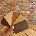 Fan of wooden NFC business cards held in one hand