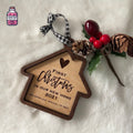 House-shaped wooden Christmas ornament engraved for a new home
