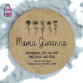 Round wooden disc engraved with flowers and a personalised Grandma message