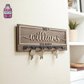 Rectangular wooden family key hanger with hooks and raised lettering